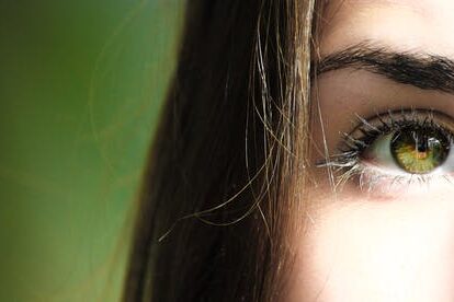 Close up of Brunette woman's green eye