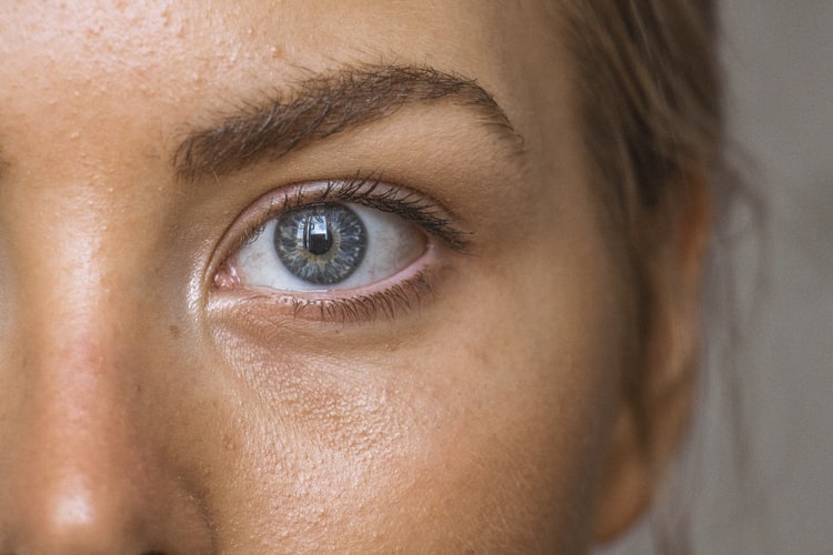 Close up of a Woman's eye with grey iris