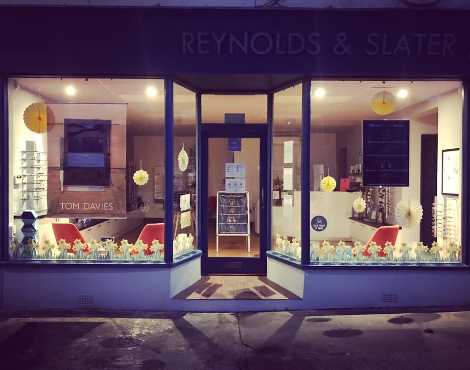 Reynolds & Slater storefront lit up at night