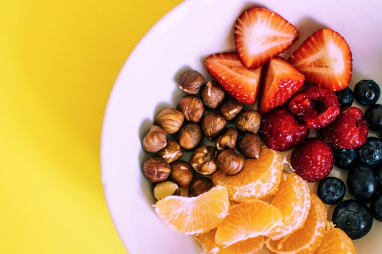 A plate of fruit and nuts